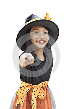 Closeup view of asian child girl with witch costume and magic wa