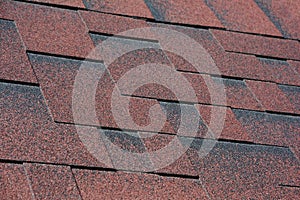 Closeup view on Asphalt Roofing Shingles Background. Roof Shingles - Roofing.