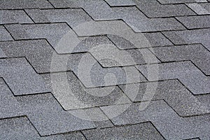 Closeup view on Asphalt Roofing Shingles Background. Roof Shingles - Roofing.