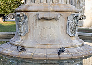 Closeup view of the base of The Fountain of Harmony in front of Castle Charles V, Lecce