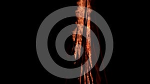 Closeup view of big burning bonfire in the darkness at night time in slow motion