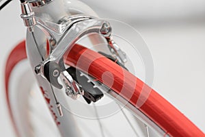 Closeup view of bike red wheel. Detail with red bike wheel isolated on white background. .