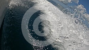 A closeup view of a boat wake going at high speed