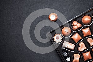 Closeup view of box of chocolates with variety chocolates pralines