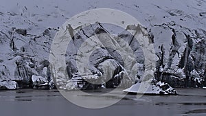 Closeup view of the breakoff edge of SÃÂ³lheimajÃÂ¶kull in the south of Iceland with white and black texture. photo