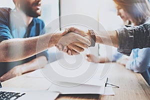 Closeup view of Business male partnership handshake. Photo two coworkers handshaking process. Successful deal after great