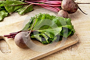 Closeup view of chard,leaves and beetroots on soup on cutting board