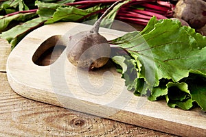 Closeup view of chard,leaves and beetroots on soup on cutting board