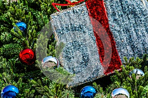 Closeup view of a Christmas tree decorated with glass balls