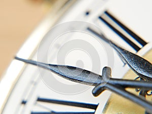Closeup view on clock. Twelve o`clock. Midnight - Midday. Macro. Vintage