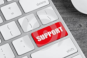 Closeup view of computer keyboard with red button.