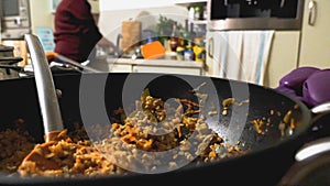 Closeup view of cooked buckweat in pan over kitchen