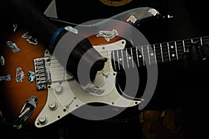 Closeup view of an electric guitar in a player hand
