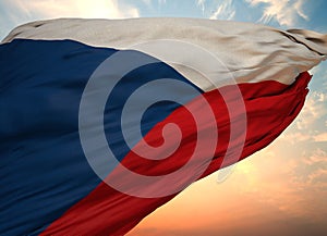 Closeup view of the flag of the Czech Republic on a background of sunset