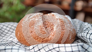 Closeup view of fresh baked bread on table in kitchen of country house, traditional food in village