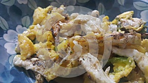 Closeup view of fried egg omelet dish in a fry pan