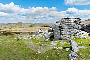 Closeup view of the granite bedrock outcrops at Top Tor, Dartmoor National Park, Devon, UK, on a bright cloudy day