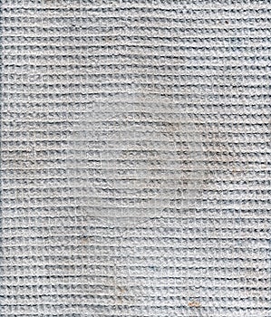 Closeup view of grey waffle fabric as texture. Product of textile industry