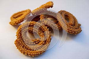 Closeup view of homemade muruku snacks isolated