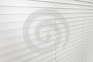 Closeup view of horizontal blinds on window indoors