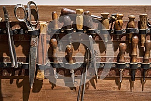 Closeup view at instruments for leather sewing