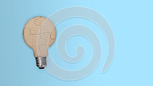 Closeup view of light bulb from a piece of the puzzle for unity and teamwork