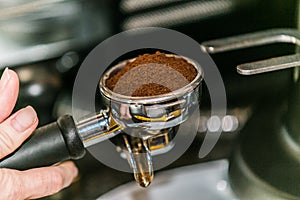 Closeup view of making espresso coffee with professional coffee machine