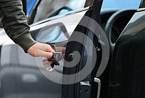 Closeup view of man opening car