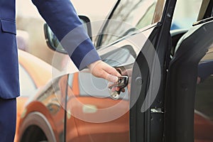 Closeup view of man opening car