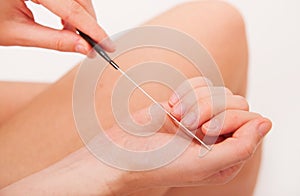 CLoseup view of manicure treatment using nail file