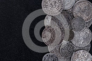 Closeup view of medieval European silver coins.Zygmunt III Waza.Ancient silver coins.Numismatics.silver coins covered in dirt.