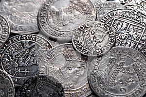 Closeup view of medieval European silver coins.Zygmunt III Waza.Ancient silver coins.Numismatics.silver coins covered in dirt.