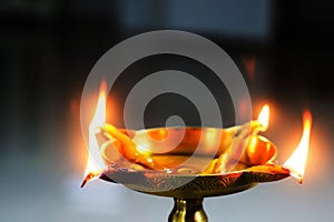 Closeup view of oil brass lamp diya for holy worship puja