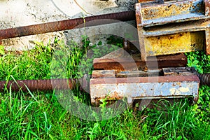 A closeup view of part of an antique rusted farm machine