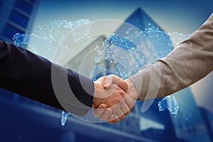 View of partners shaking hands and world map. Business values photo