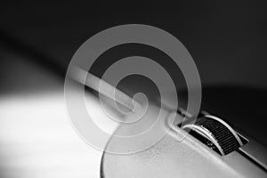 Closeup view of pc mouse on the table. BW photo