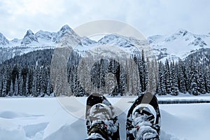 A closeup view of a person and their pair of snowshoes in Fernie, British Columbia, Canada. photo