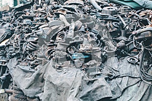 Closeup view of pile of old rusty metal scrap and used spare parts, disassembly. Old car parts suitable for future use.