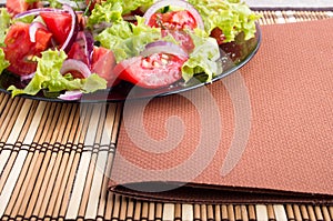 Closeup view of a plate with fresh salad