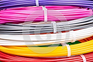 Closeup view of rolled wires for filament plastic for 3D printing pen
