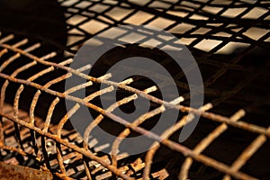 Closeup view of a rusty grate. Old metal fence