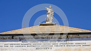 Closeup view of the statue on top of the Opera House, Piazza de Ferrari, Genoa, Italy photo