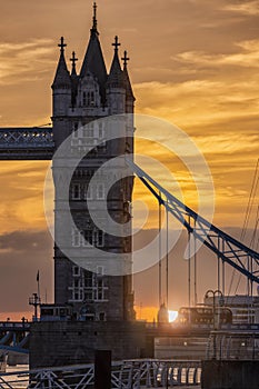 Closeup view to a colorful sunset behind the iconic Tower Bridge in London