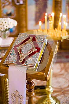 Closeup view to Holy bible on lectern during a wedding ceremony in an Orthodox church