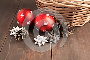 Closeup view of two ornaments balls over brown wooden table