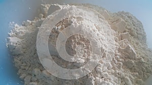 Closeup view of wheat flour heap placed in market for sale