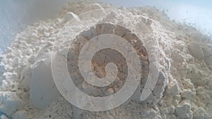 Closeup view of wheat flour heap placed in market for sale