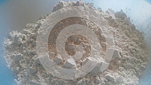 Closeup view of wheat flour heap placed in market for sale