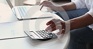 Closeup view woman paying bills online, manage household finances