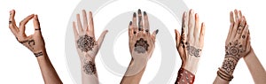 Closeup view of women with henna tattoo on hands against white background. Traditional mehndi ornament